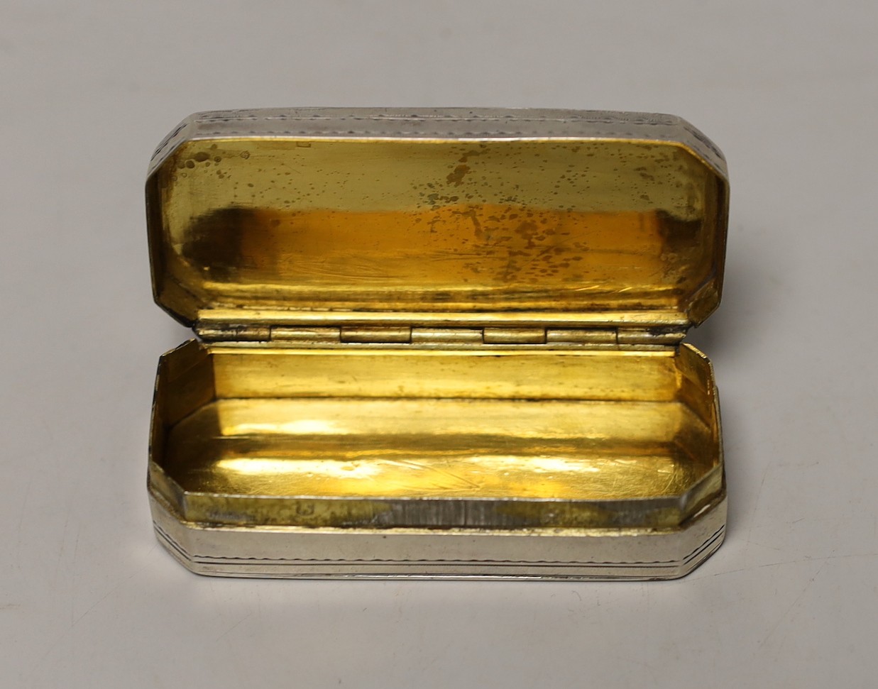 An early 19th century Dutch? engraved white metal rectangular snuff box, with canted corners, 84mm, 103 grams.